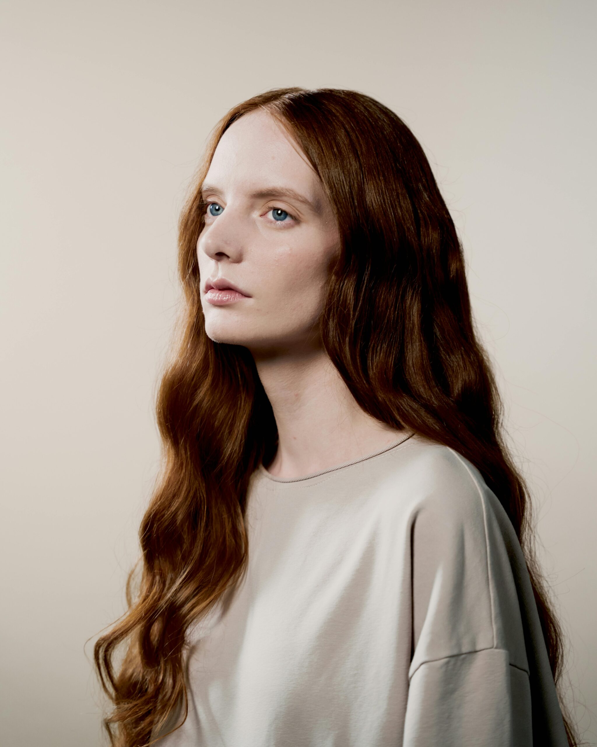 Young lady with thick long reddish hair